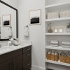 Upscale bathroom with large sink vanity and mirror at The Opal apartments in Fort Worth, TX